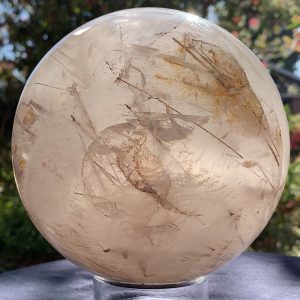 White Angelic Quartz Crystal Sphere with Rutiles and Hematite
